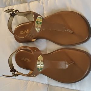MK plate thong sandals